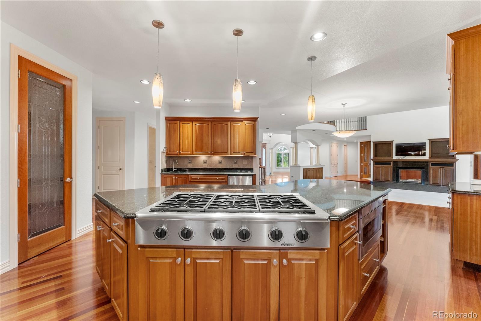 14046 Lexington Circle Westminster, CO 80023 - Photo 13 of 40 a kitchen with stainless steel appliances granite countertop a stove and a sink