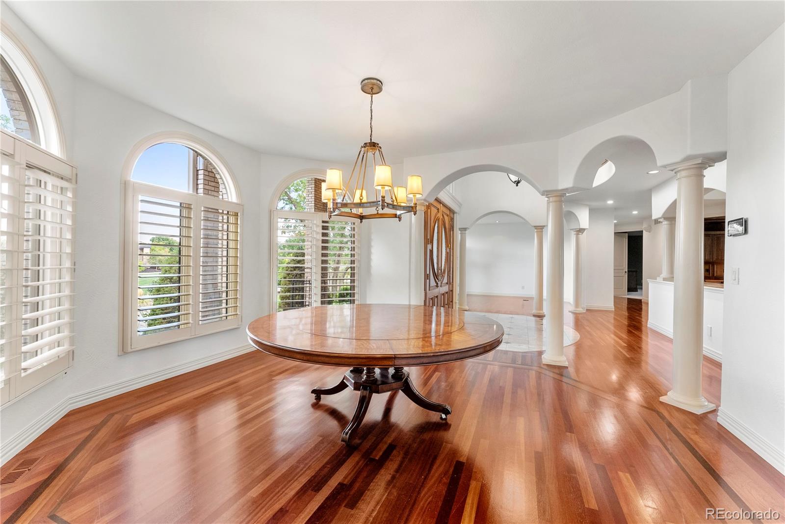 14046 Lexington Circle Westminster, CO 80023 - Photo 15 of 40 a view of a room with furniture window and wooden floor