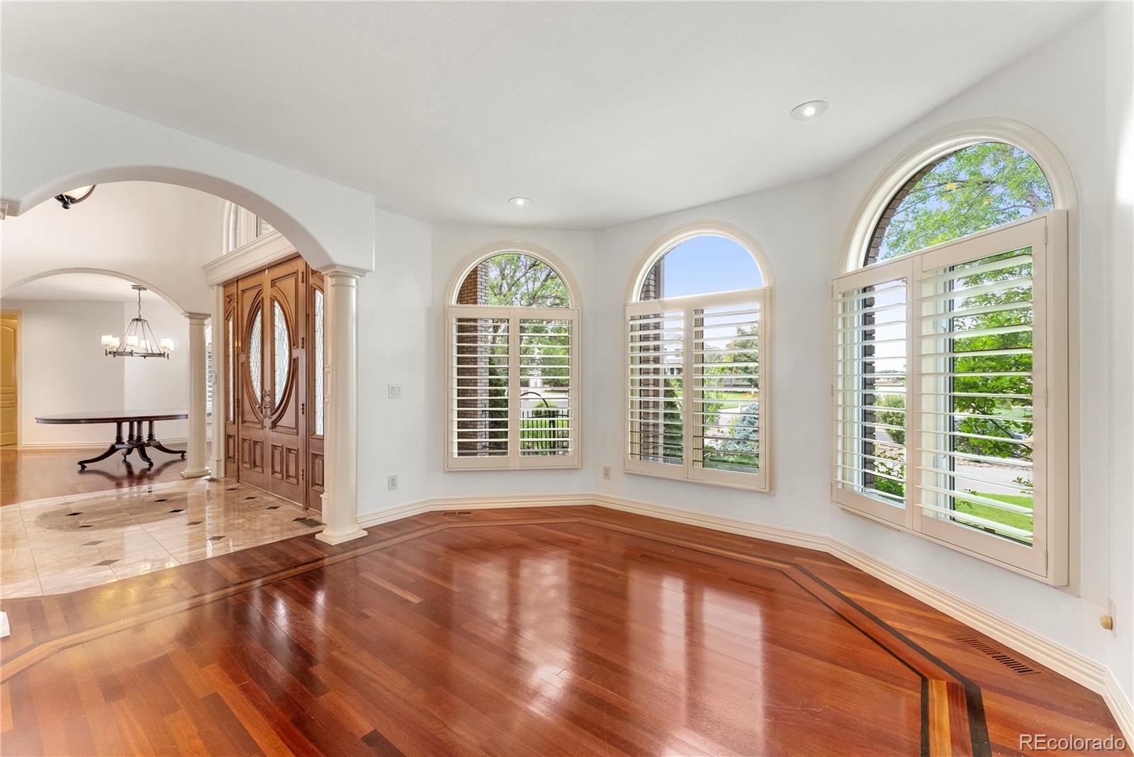 14046 Lexington Circle Westminster, CO 80023 - Photo 17 of 40 a view of livingroom with a flat screen tv and a large window