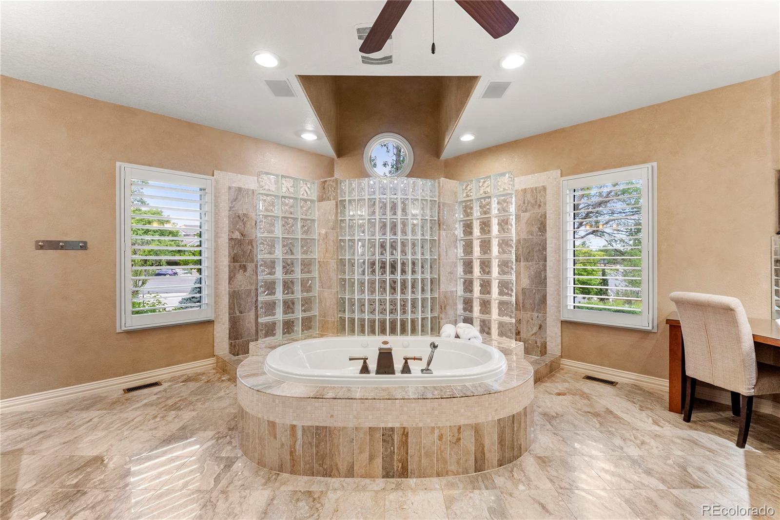 14046 Lexington Circle Westminster, CO 80023 - Photo 20 of 40 a bathroom with a bathtub and shower