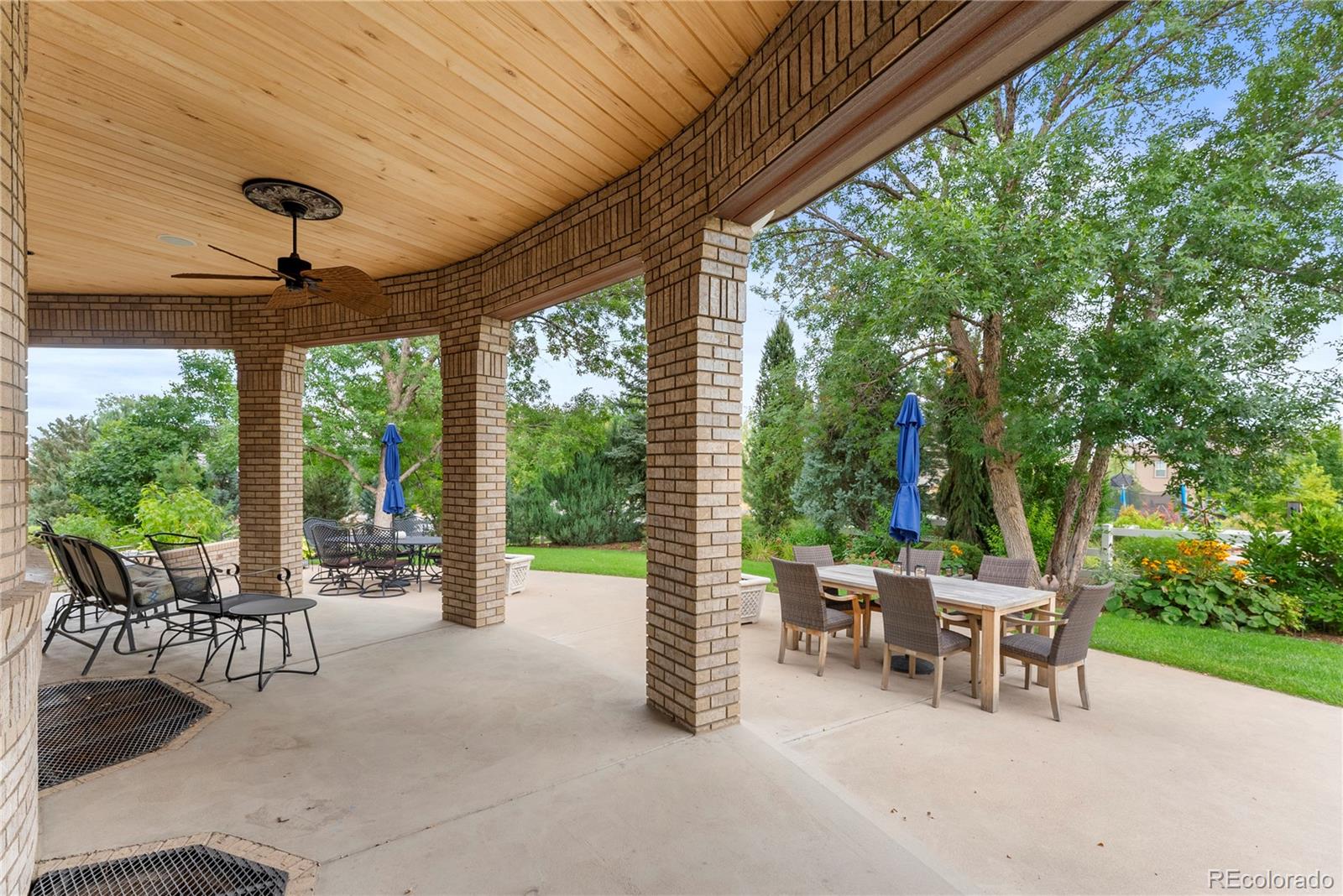 14046 Lexington Circle Westminster, CO 80023 - Photo 29 of 40 a view of a patio with a table chairs and backyard