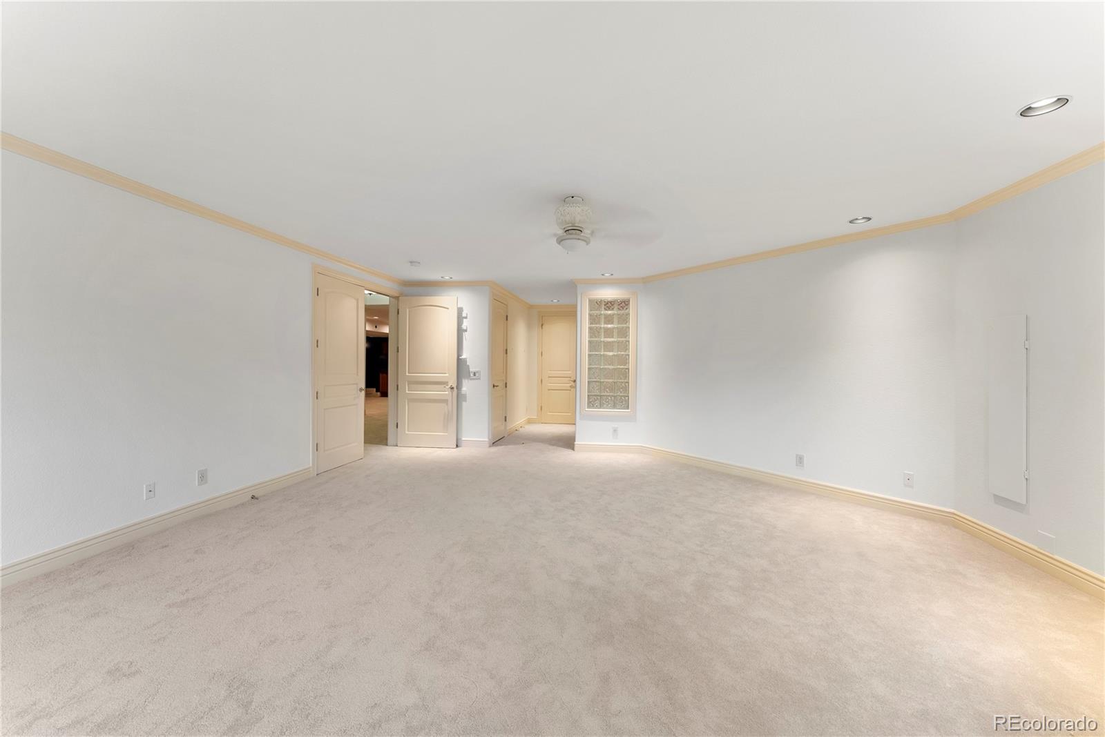 14046 Lexington Circle Westminster, CO 80023 - Photo 36 of 40 a view of an empty room with a window
