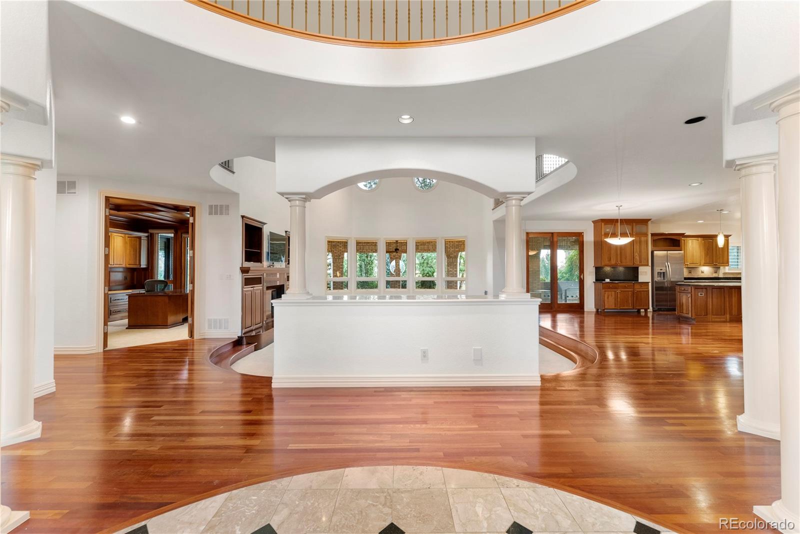 14046 Lexington Circle Westminster, CO 80023 - Photo 6 of 40 a view of a living room and kitchen view