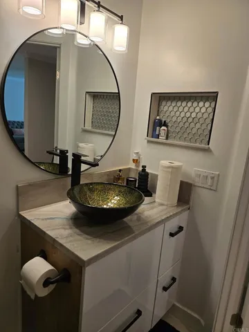 a view of a livingroom with furniture and mirror