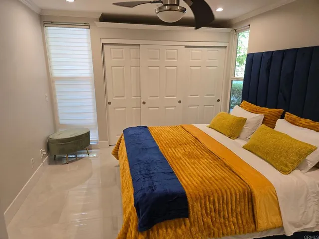 a bedroom with a bed and a closet