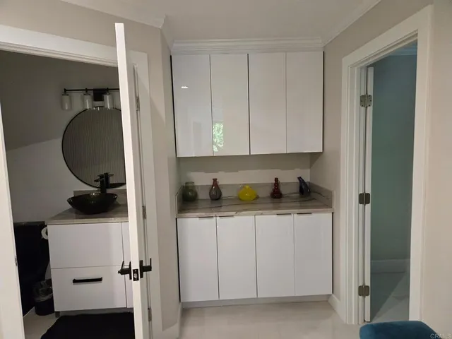 a view of cabinets and wooden floor