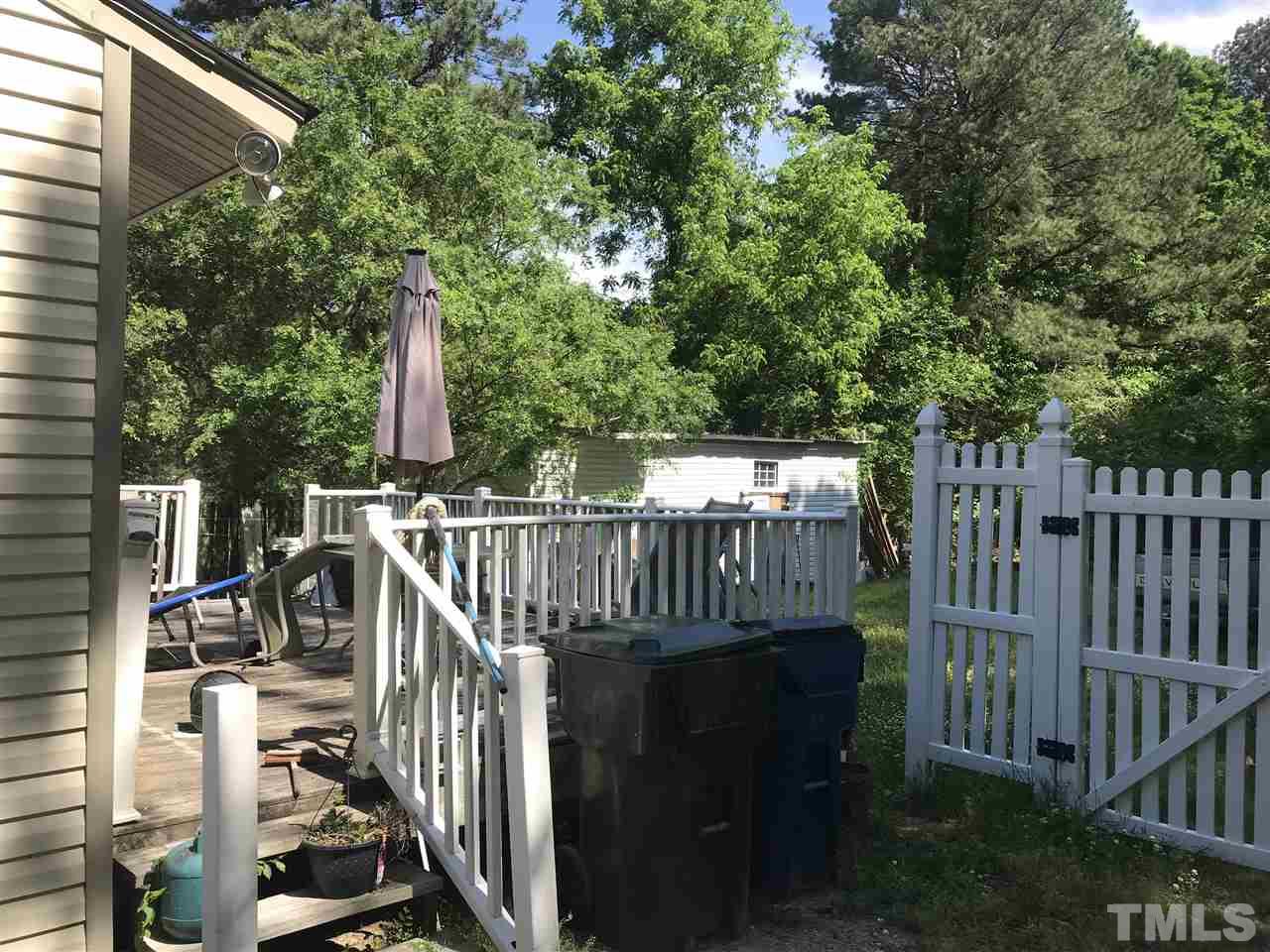 1909 Tee Dee Street Raleigh, NC 27610 - Photo 13 of 17 a view of street along with deck and trees