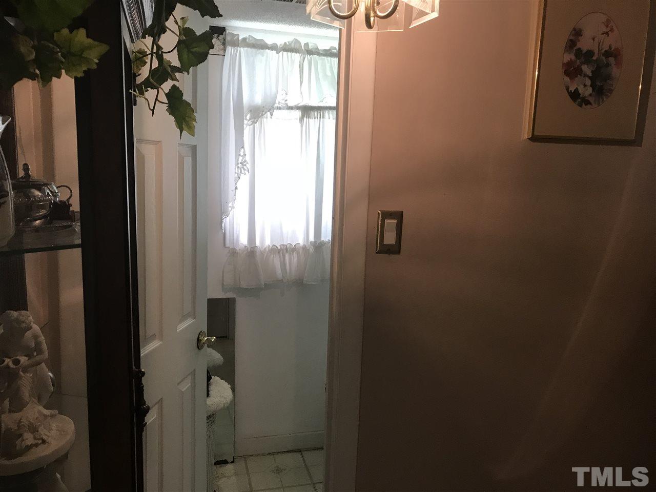1909 Tee Dee Street Raleigh, NC 27610 - Photo 8 of 17 a bathroom with a shower and toilet