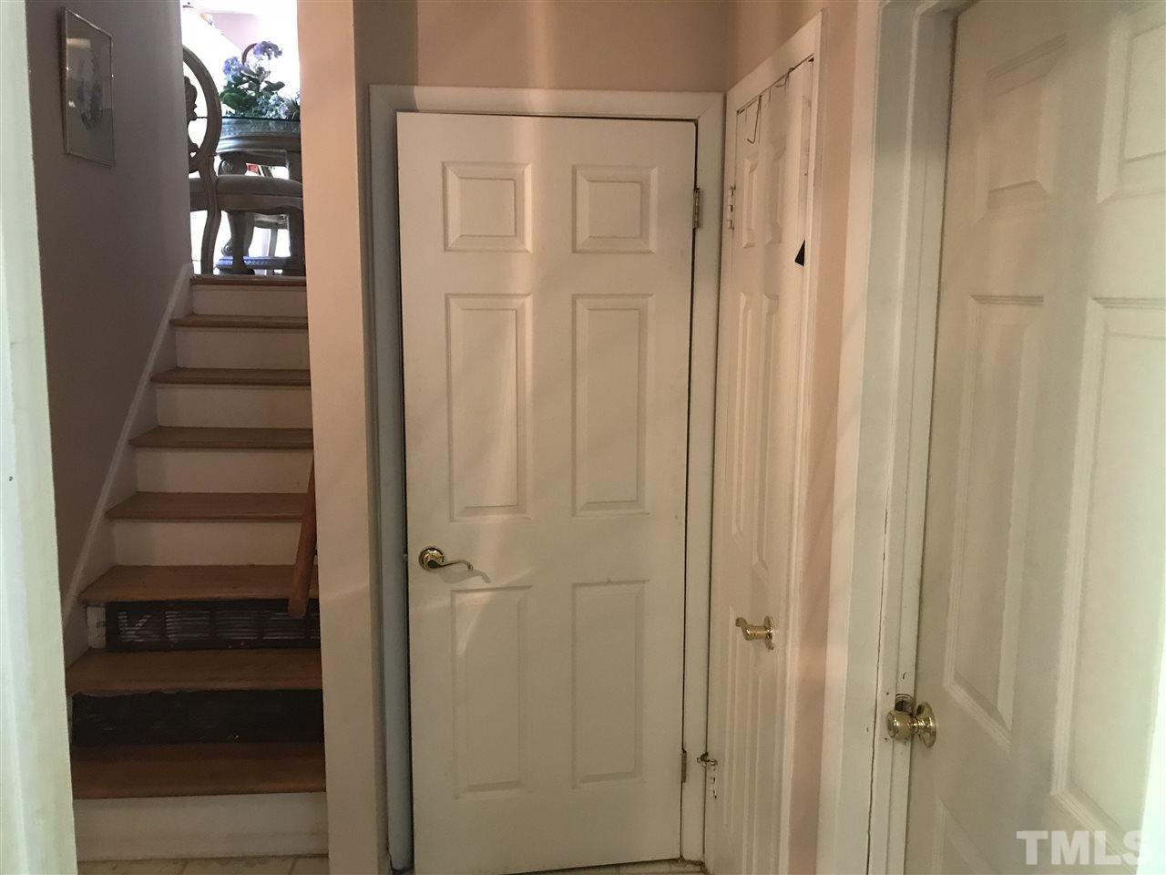 1909 Tee Dee Street Raleigh, NC 27610 - Photo 9 of 17 a view of a hallway with wooden floor and entryway