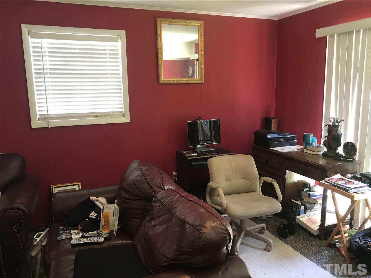 1909 Tee Dee Street Raleigh, NC 27610 - Photo 10 of 17 a room with furniture and a window