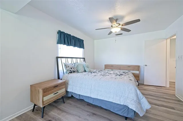 a view of a workspace with furniture and a potted plant