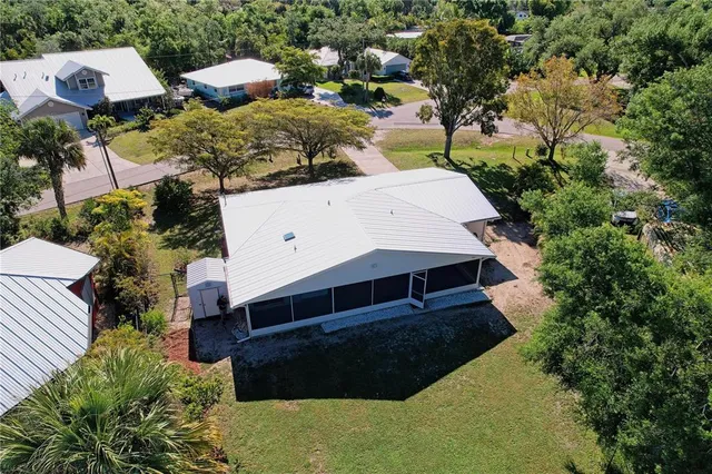 a view of a field of grass and trees