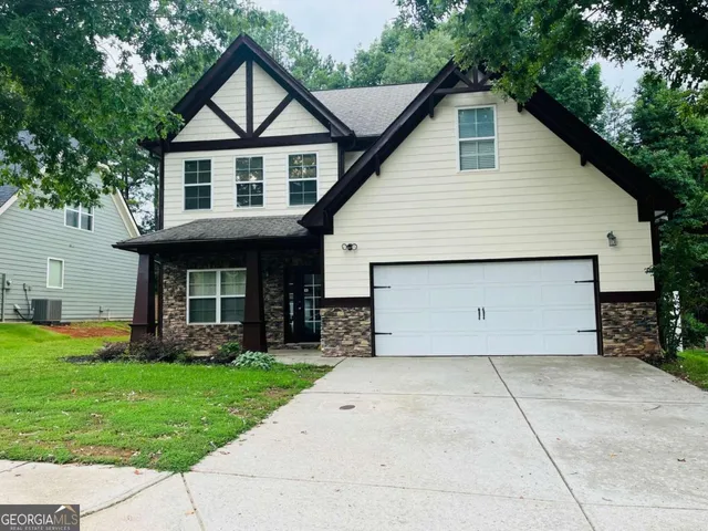 a view of a yard in front view of a house