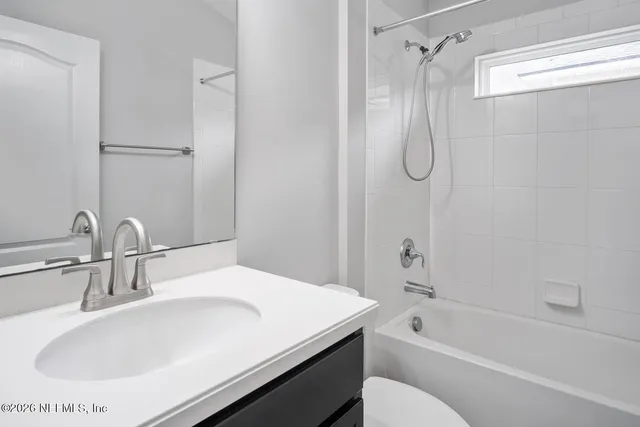 a bathroom with a sink and a bathtub