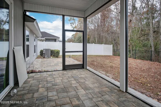 a view of a glass door and the balcony