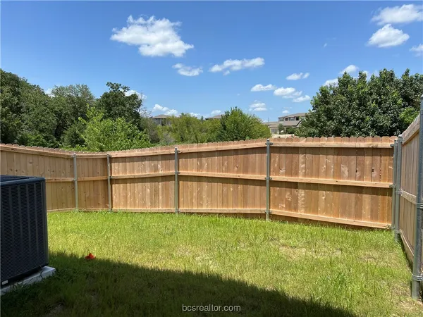 a view of a backyard with a garden