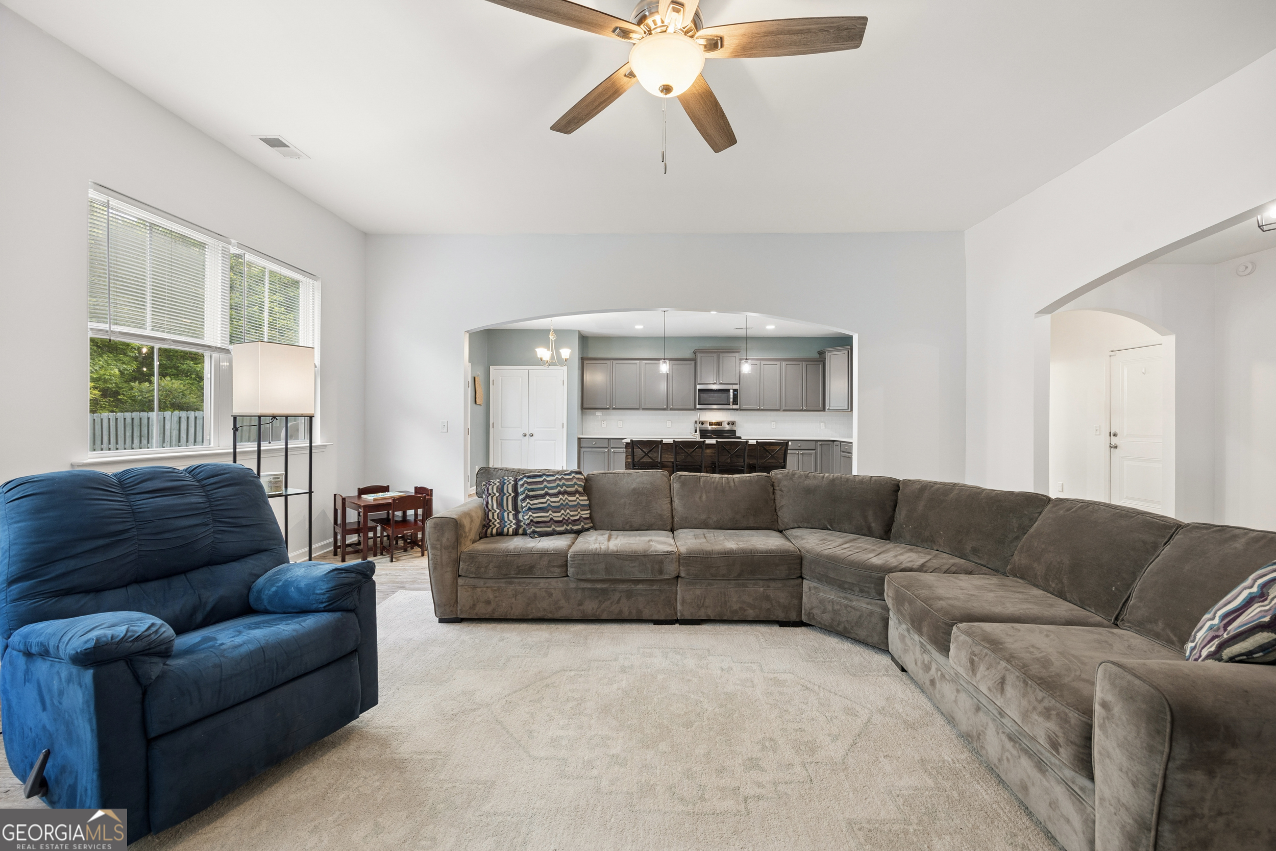 369 Waybridge Way Richmond Hill, GA 31324 - Photo 9 of 40 a living room with furniture and a large window