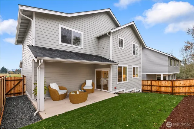a view of an empty room and a fireplace