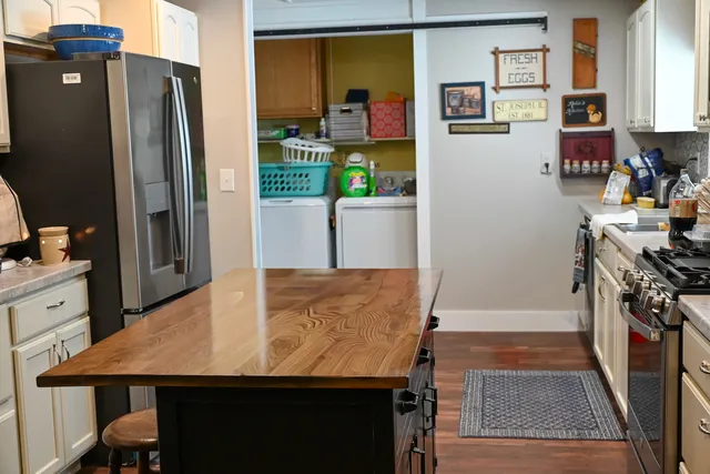 a kitchen with a stove and a microwave