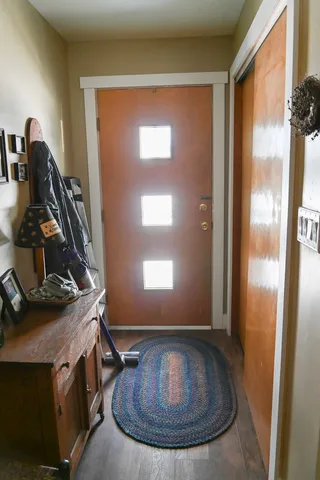 a view of a room with wooden floor