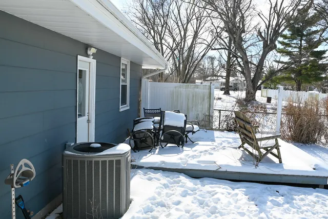 a view of a patio with wooden fence