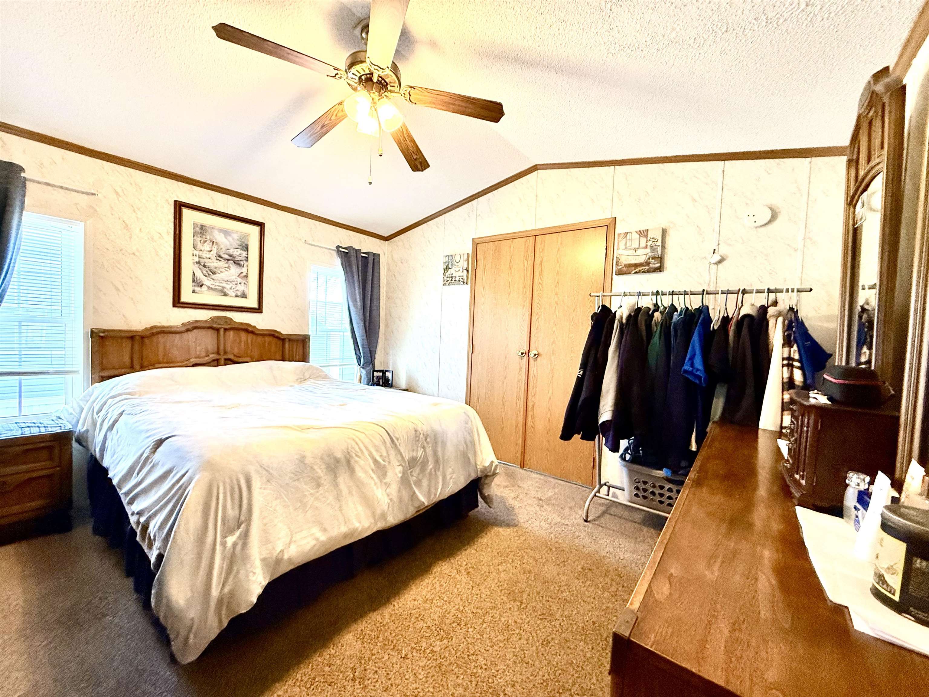 68 Priest Boulevard Rio Grande, NJ 08242 - Photo 11 of 28 a bedroom with a bed and a chandelier