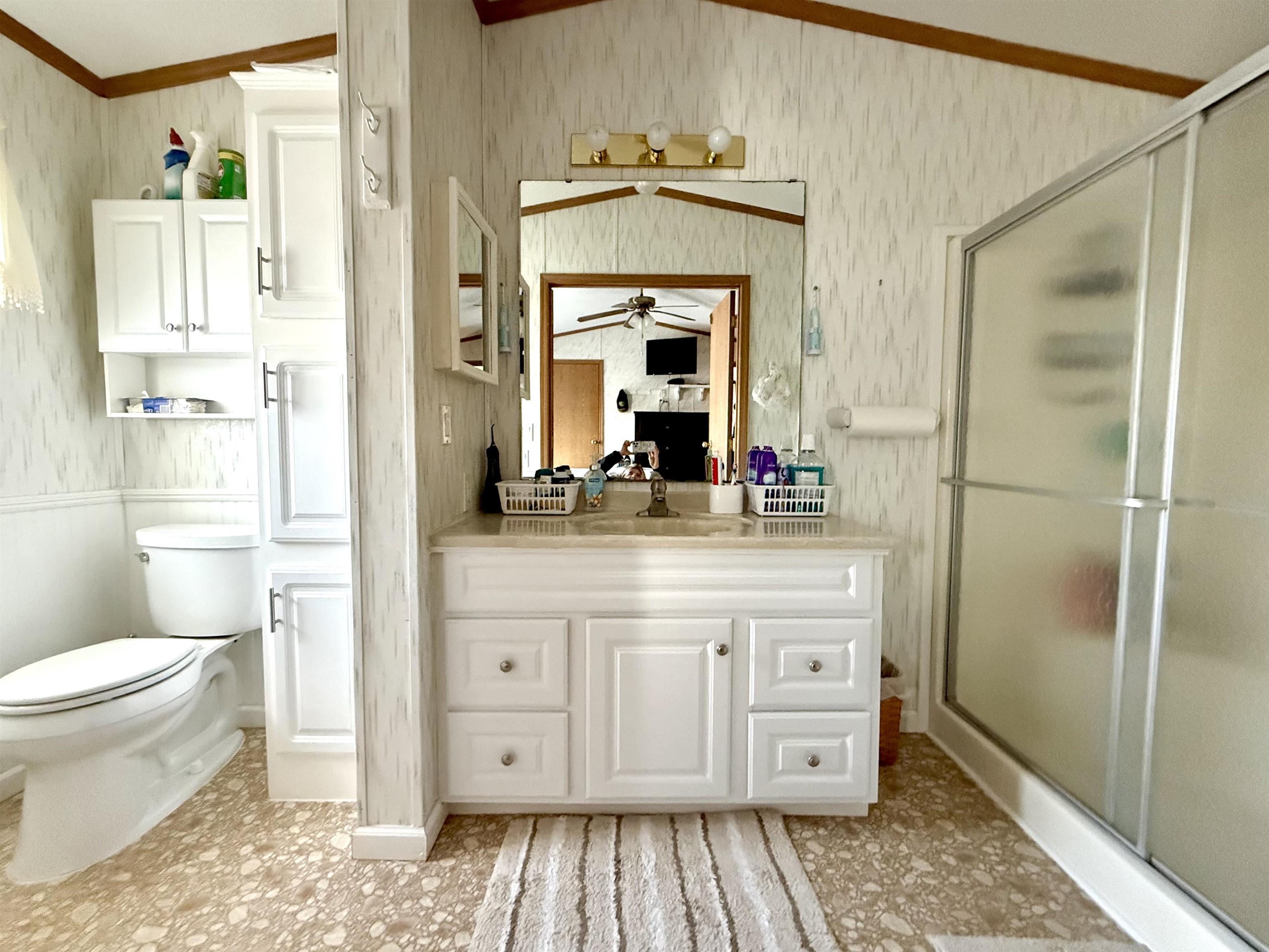 68 Priest Boulevard Rio Grande, NJ 08242 - Photo 12 of 28 a bathroom with a granite countertop sink toilet a mirror and shower