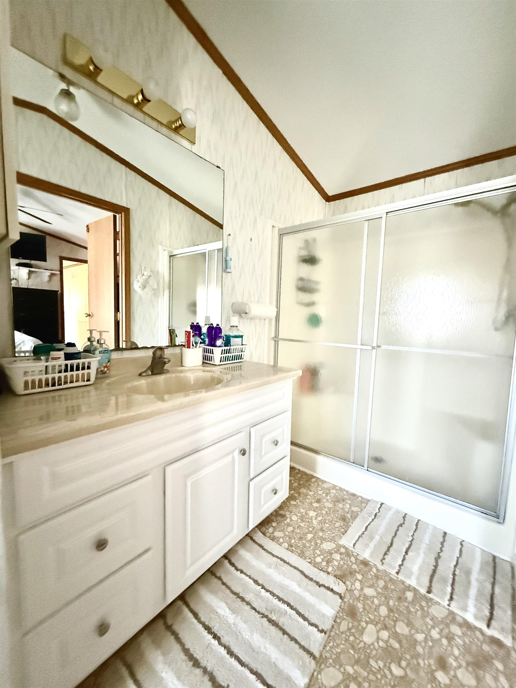 68 Priest Boulevard Rio Grande, NJ 08242 - Photo 13 of 28 a bathroom with a double vanity sink a mirror and a shower