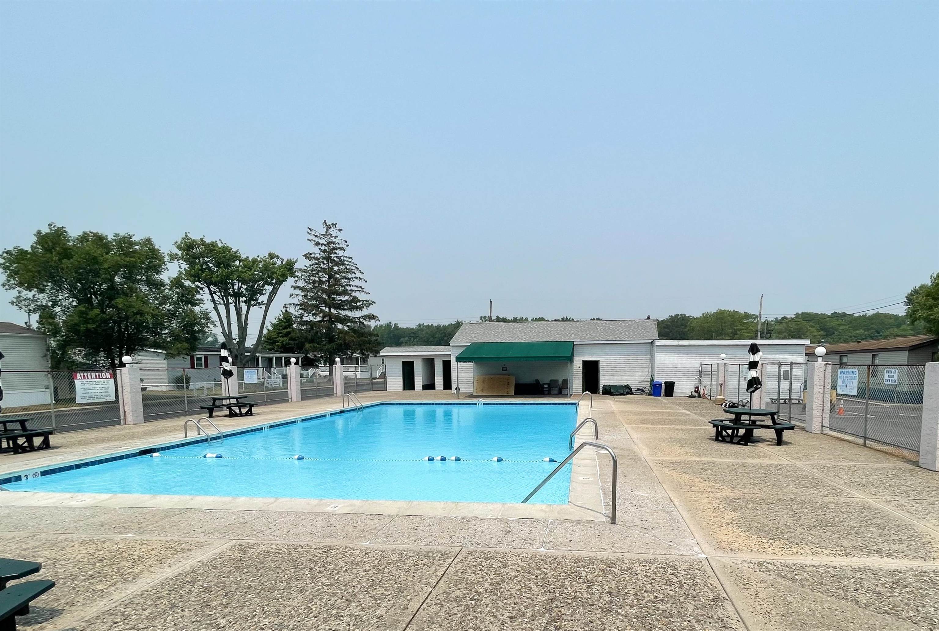 68 Priest Boulevard Rio Grande, NJ 08242 - Photo 26 of 28 a view of a swimming pool with lawn chairs and couches