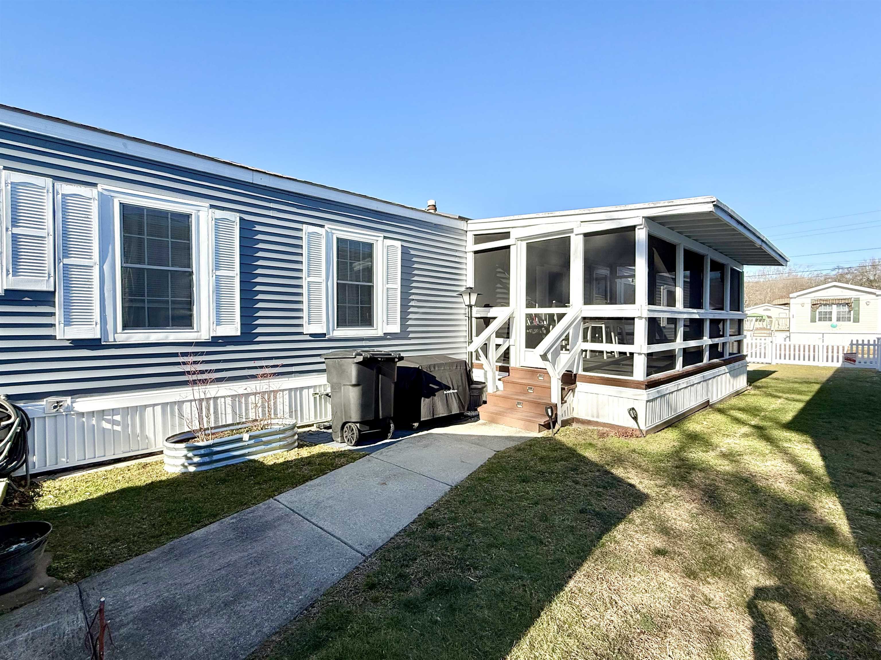 68 Priest Boulevard Rio Grande, NJ 08242 - Photo 4 of 28 a view of a house with a swimming pool and sitting area