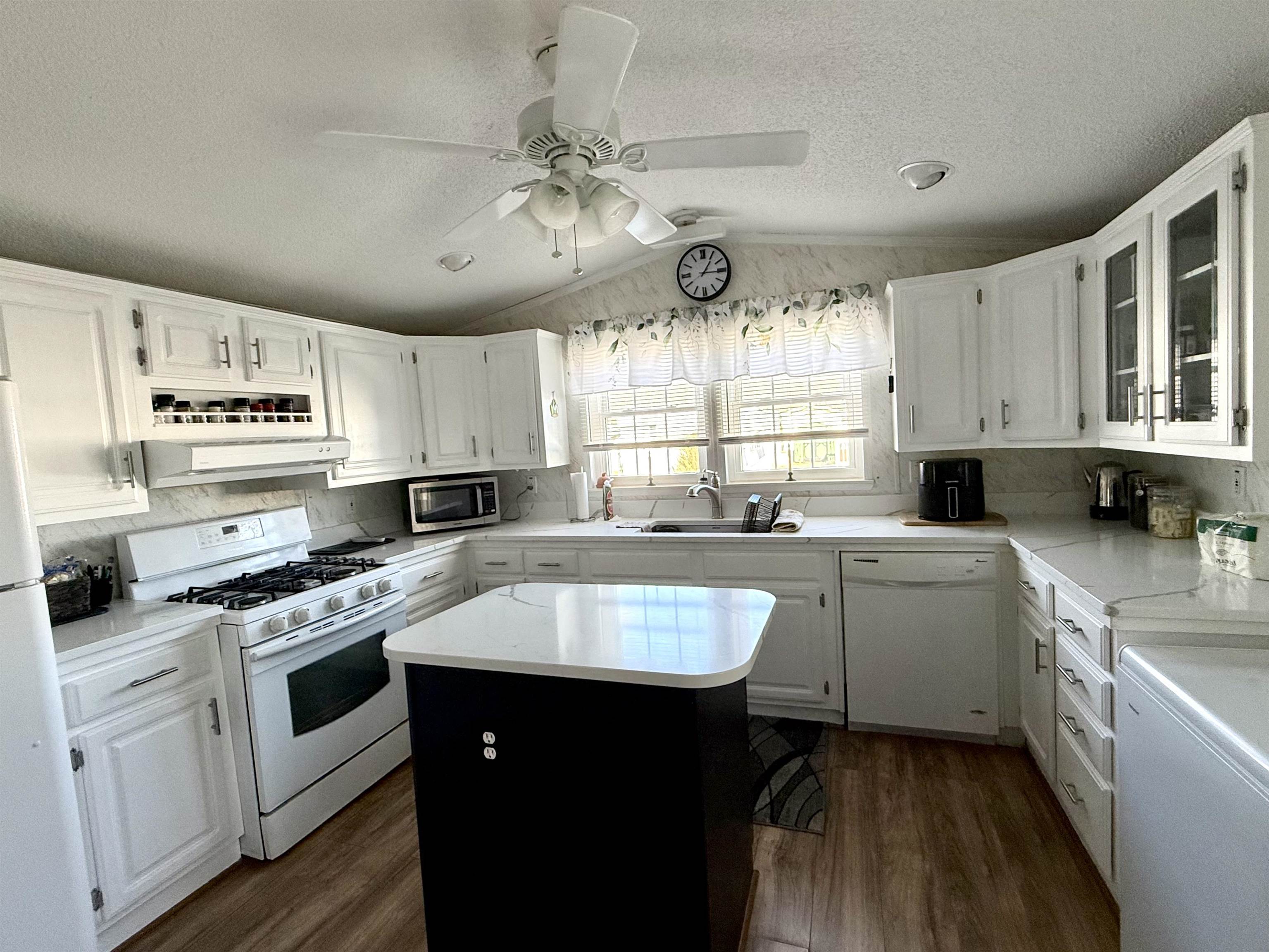 68 Priest Boulevard Rio Grande, NJ 08242 - Photo 8 of 28 a kitchen with a sink stove cabinets and window