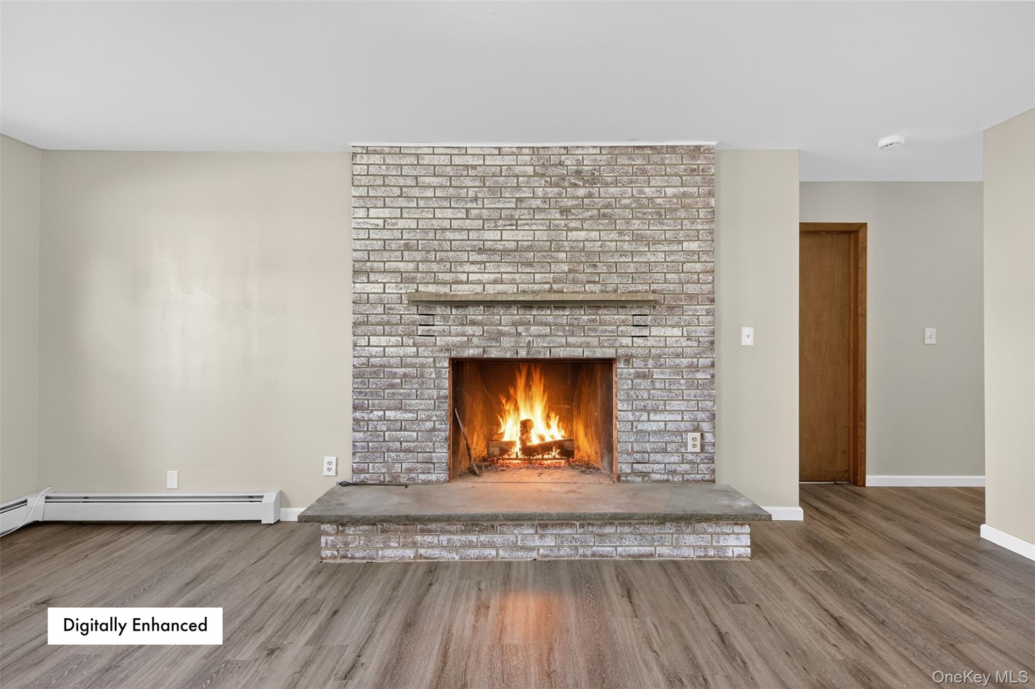 13 Farmstead Road New Windsor, NY 12553 - Photo 13 of 27 a view of an empty room with wooden floor and a fireplace