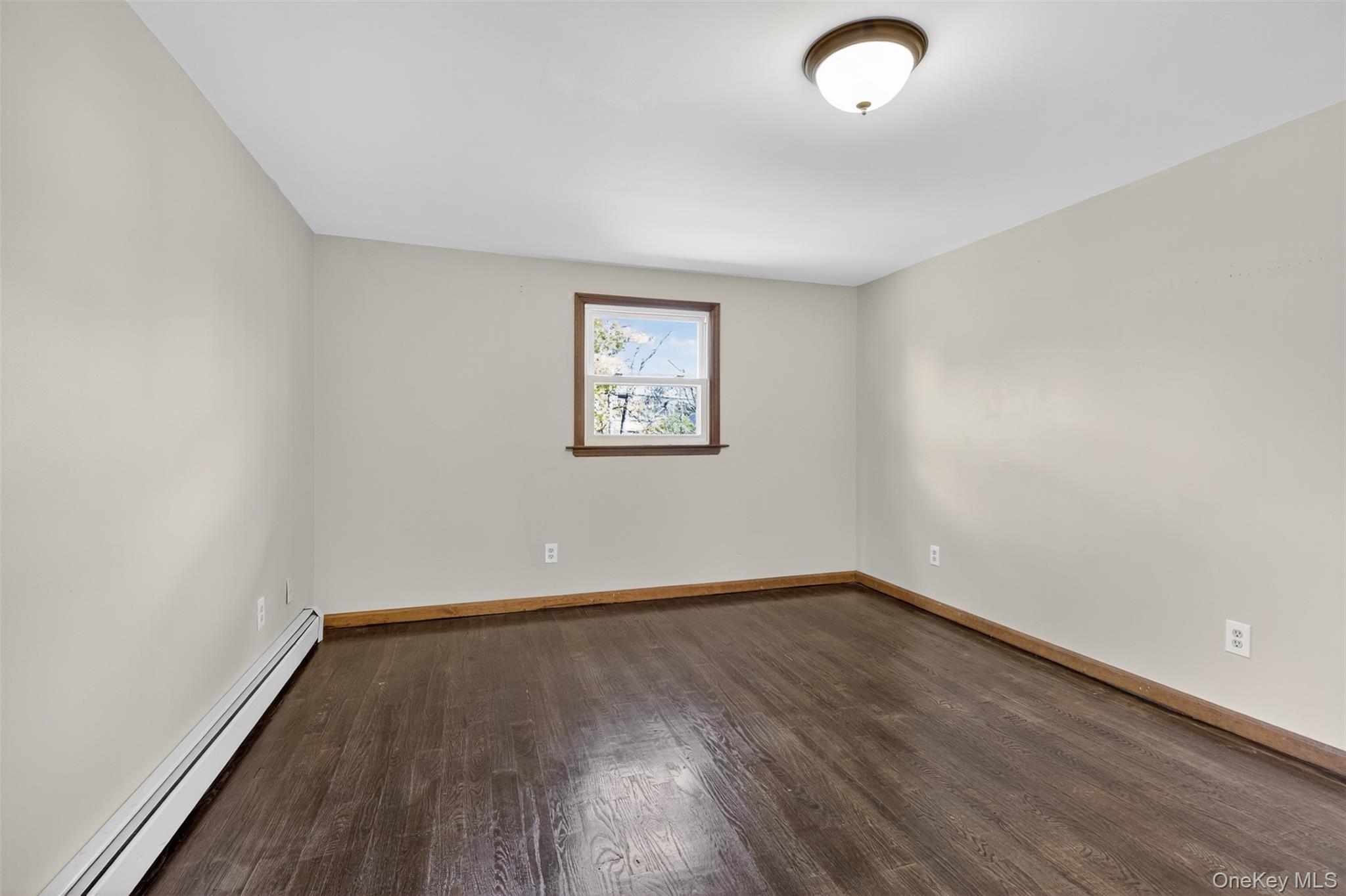 13 Farmstead Road New Windsor, NY 12553 - Photo 17 of 27 an empty room with wooden floor and windows