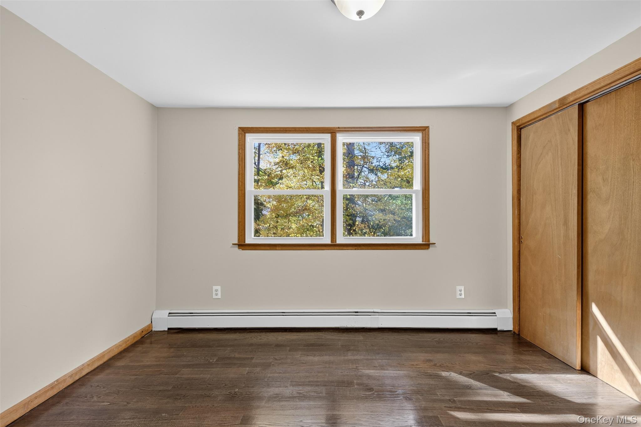13 Farmstead Road New Windsor, NY 12553 - Photo 20 of 27 an empty room with wooden floor and windows