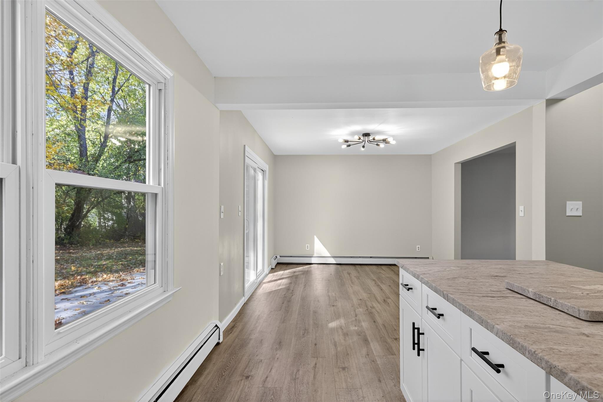 13 Farmstead Road New Windsor, NY 12553 - Photo 8 of 27 a view of kitchen and hallway with wooden floor