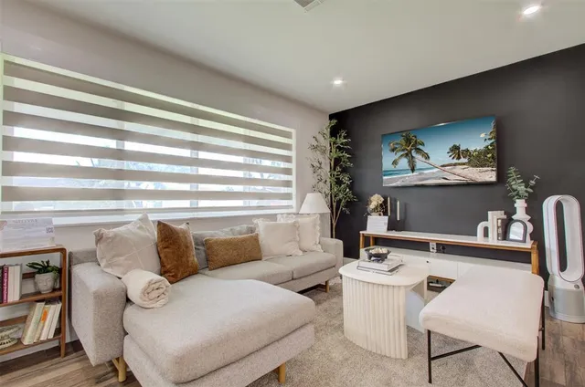 a view of a dining room with furniture and window