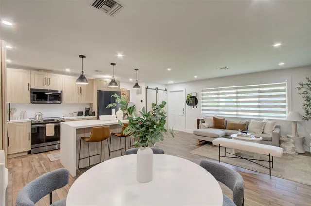 a living room with furniture and a table