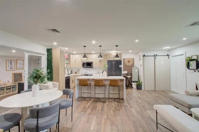 a bedroom with a large bed and a flat screen tv