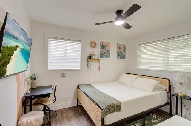 a view of a backyard with a patio and a garden