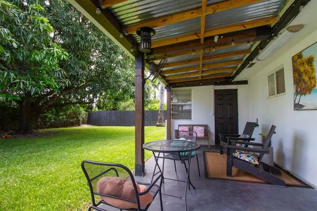 a front view of a house with a garden and yard