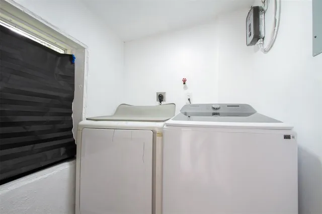 an aerial view of residential houses with city view