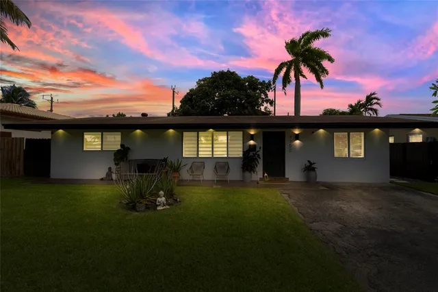 an aerial view of residential houses with city view