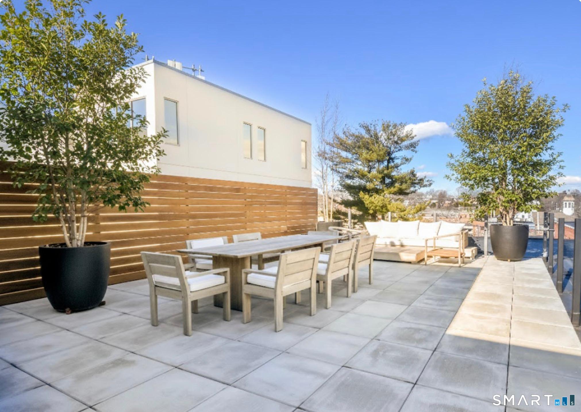 a outdoor space with a couch and chairs