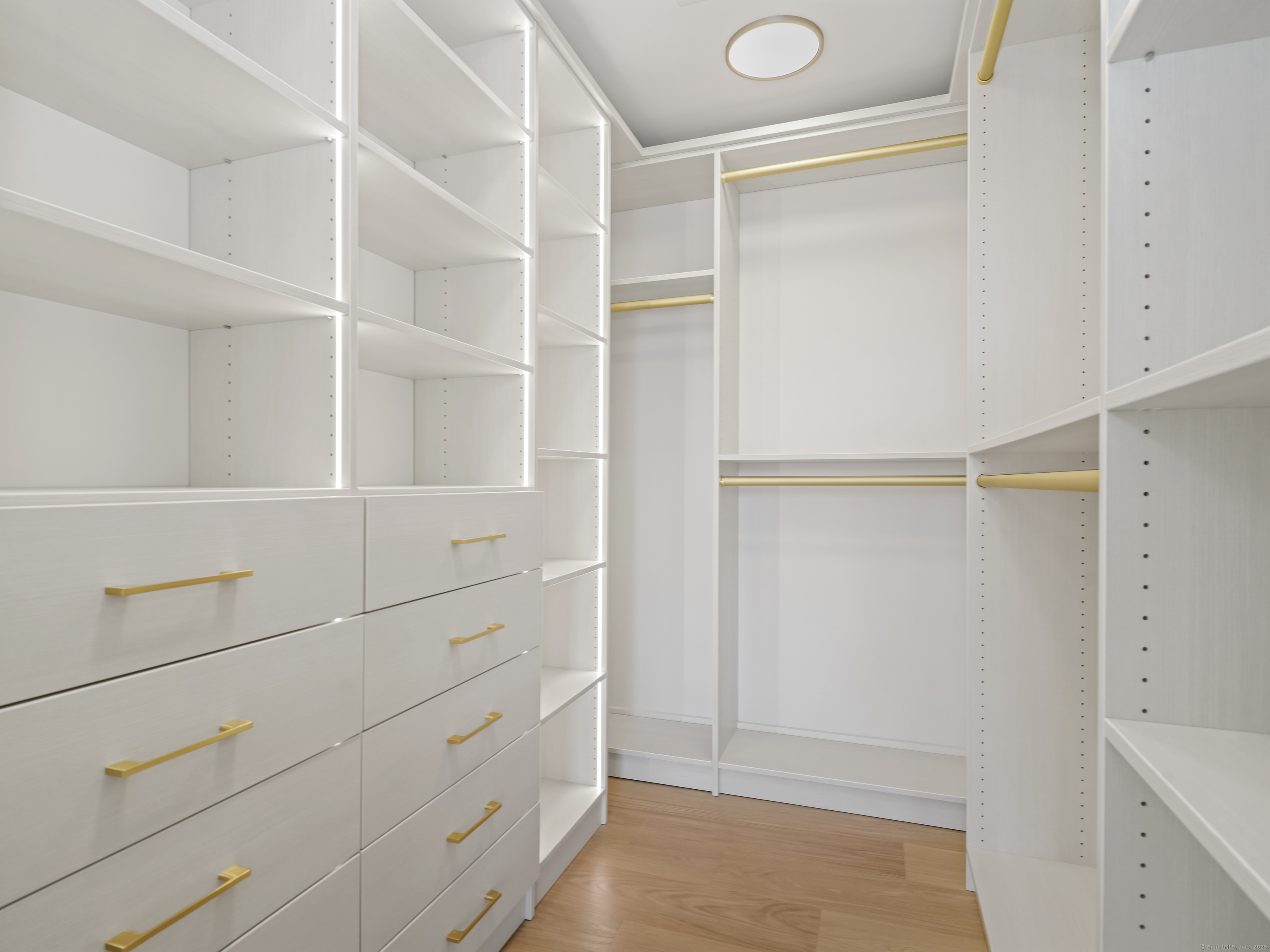 116 Sherman Street, Unit 2 Fairfield, CT 06824 - Photo 20 of 31 a view of an empty walk in closet