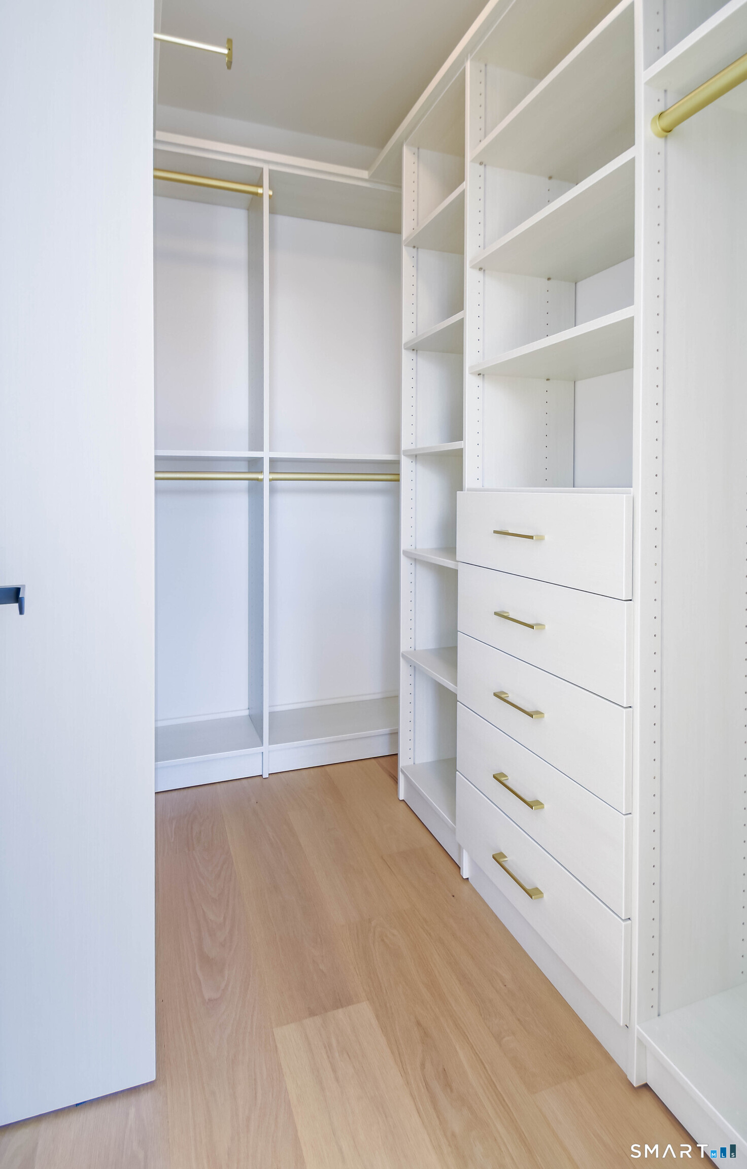 116 Sherman Street, Unit 2 Fairfield, CT 06824 - Photo 25 of 31 a view of an empty walk in closet