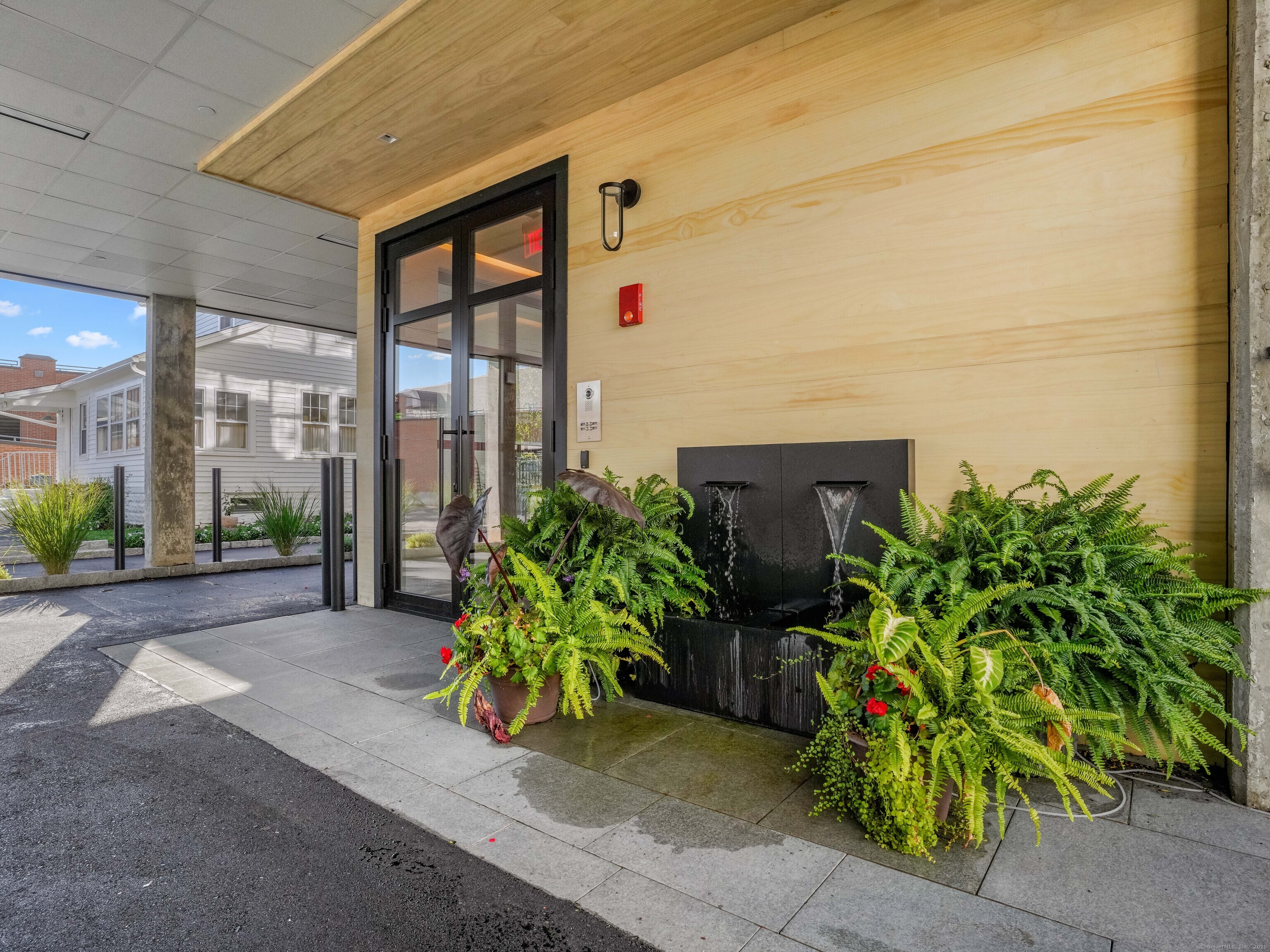 116 Sherman Street, Unit 2 Fairfield, CT 06824 - Photo 3 of 31 a couple of potted plants in front of door