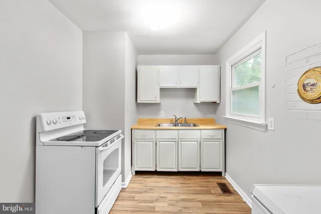 a view of cabinets and wooden floor