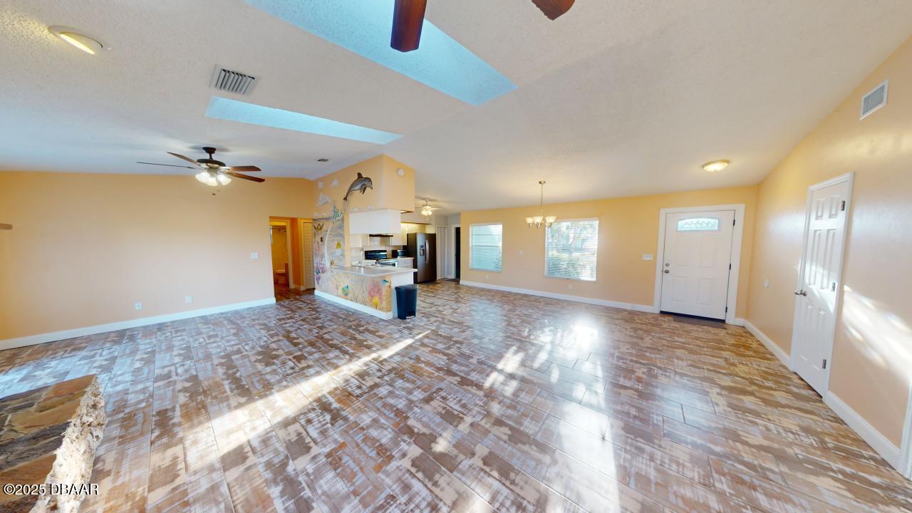 2219 Umbrella Tree Drive Edgewater, FL 32141 - Photo 2 of 22 2219-Umbrella-Tree-Drive-Kitchen-Living-