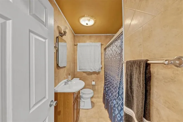 a bedroom with two beds and a window