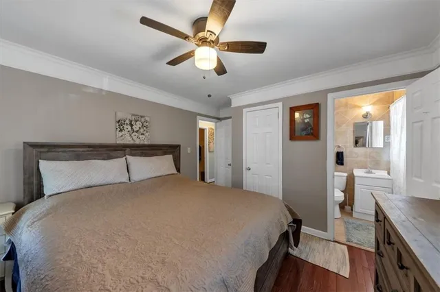 a bathroom with a toilet sink and shower